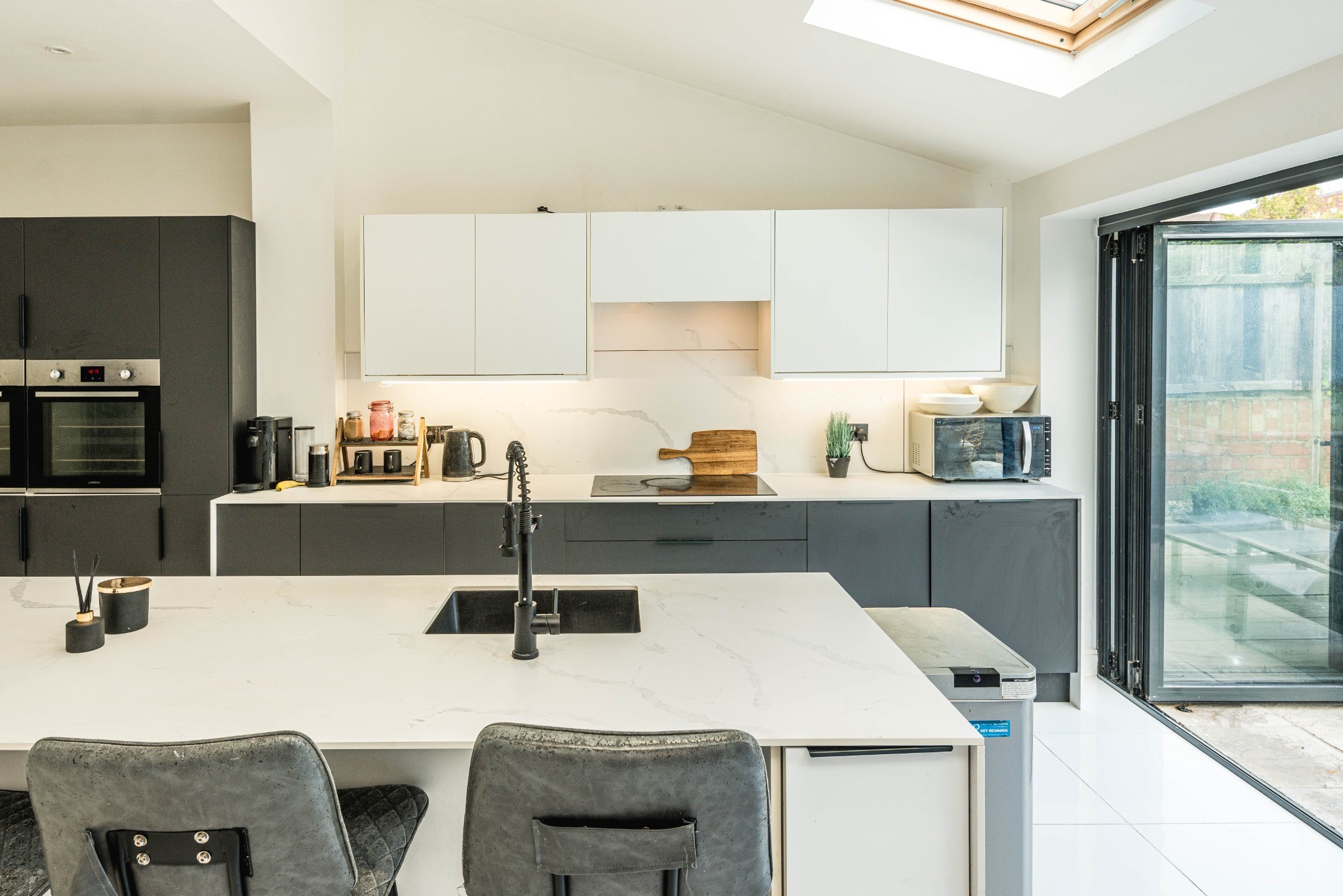 Kitchen island, rooflights and garden doors in the completed Hither Green renovation